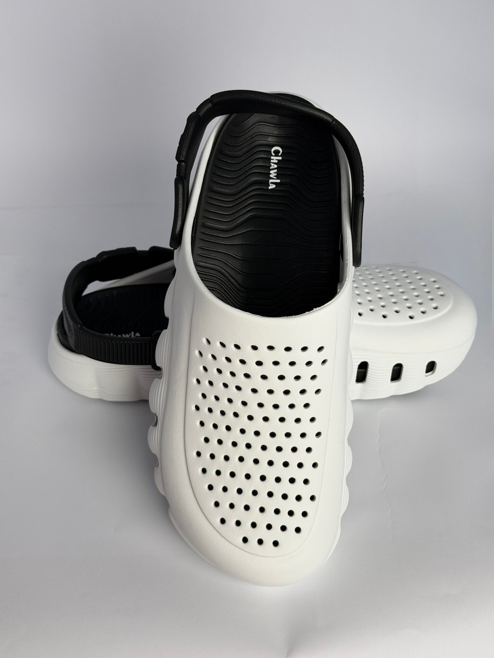 Chawla men's white ventilated clogs with black footbed and heel strap