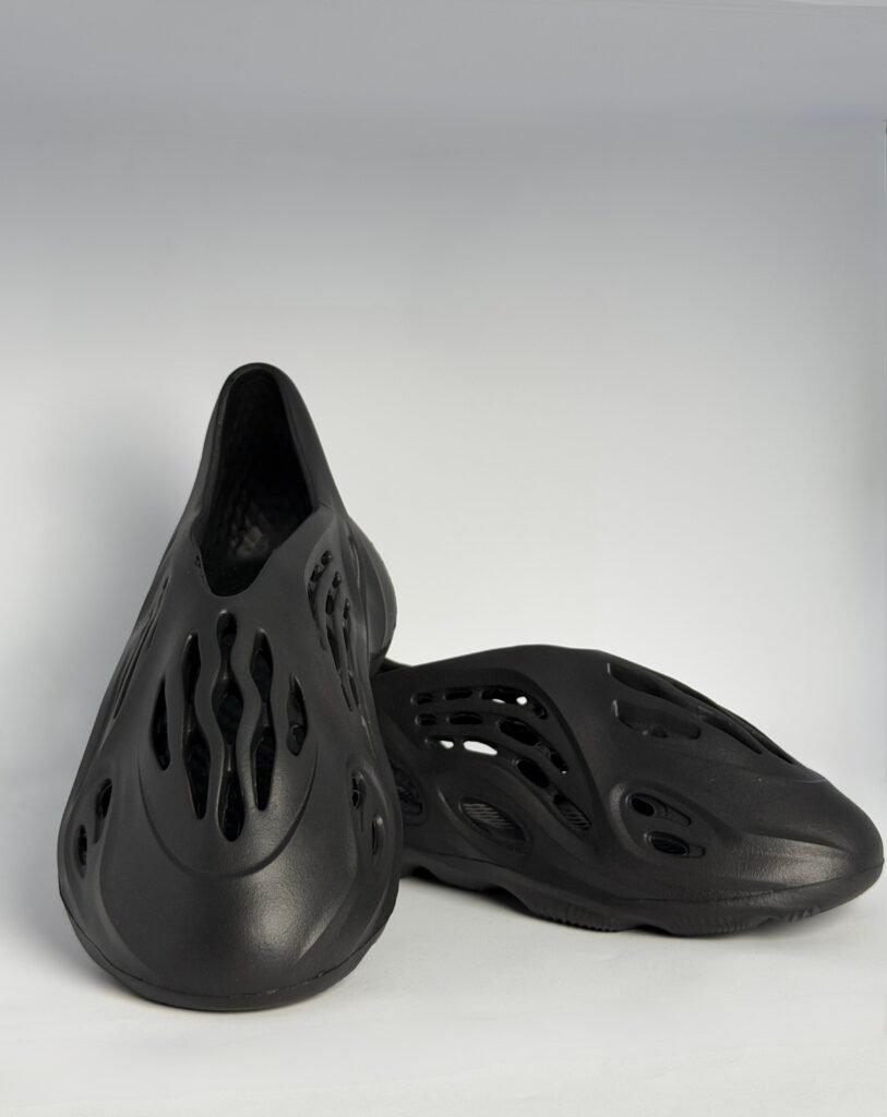 Men's all black futuristic foam runner clogs with carved ventilation cutouts